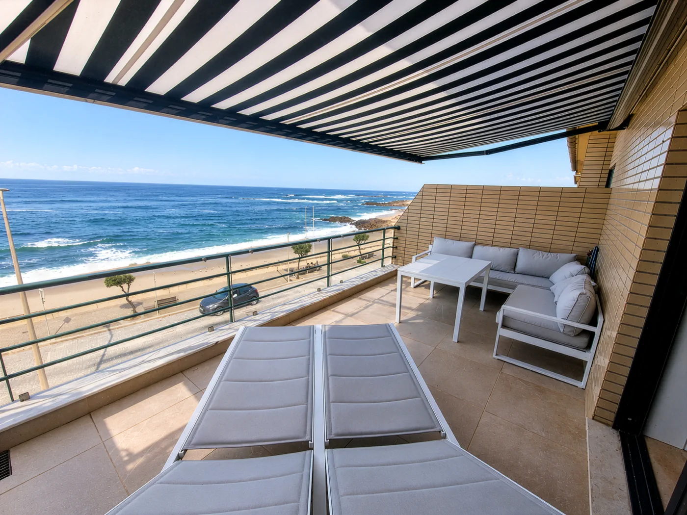 Private seafront terrace with retractable awning
